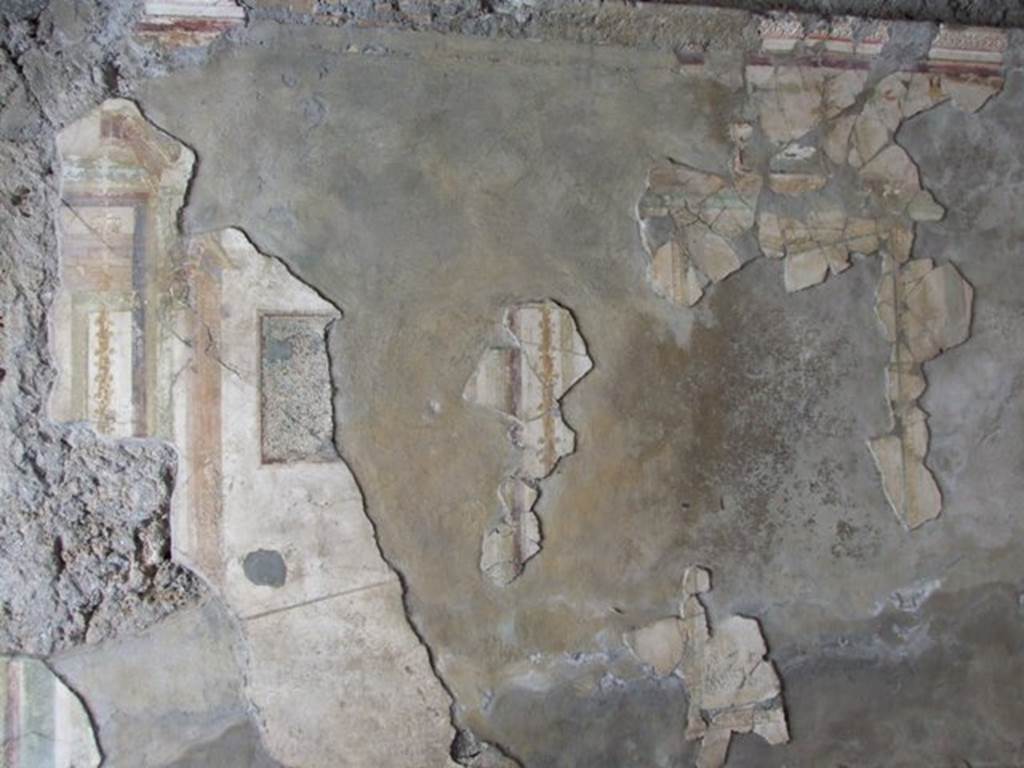 V.2.1 Pompeii. March 2009. Room 8, south wall. Remains of fragments of recomposed wall plaster. The painting of Poseidon and Amymone was originally found on this wall.  The house was badly damaged by a bomb in 1943, and the majority of the paintings reduced to fragments.  The fragments are now put back together, as best as possible.