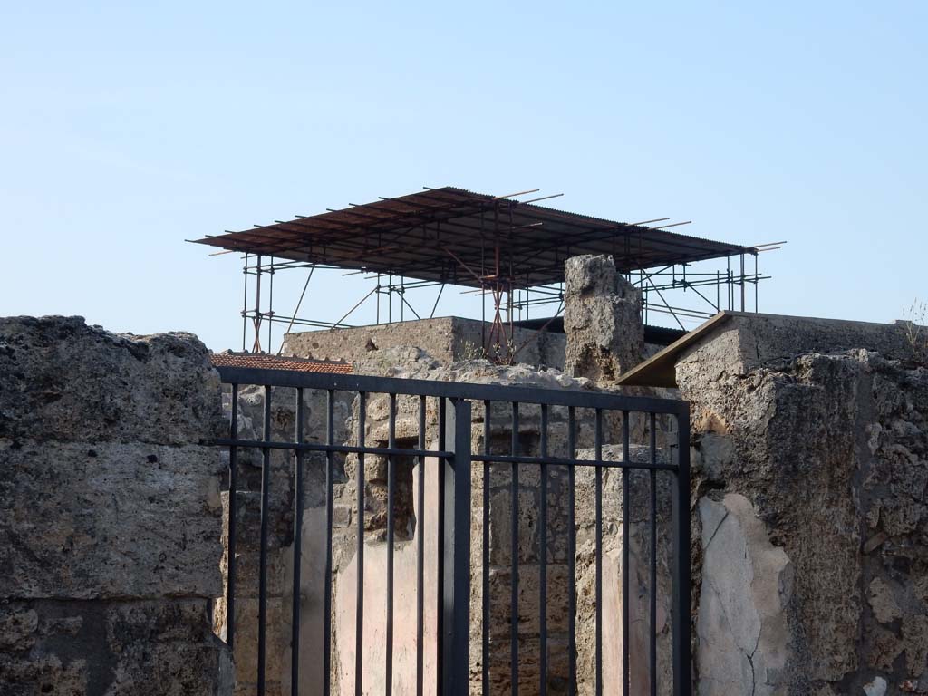 V.2.4 Pompeii. June 2019. 
Looking north-east from entrance doorway towards doorway to room 10 with window in room 9, on its left.
Photo courtesy of Buzz Ferebee.