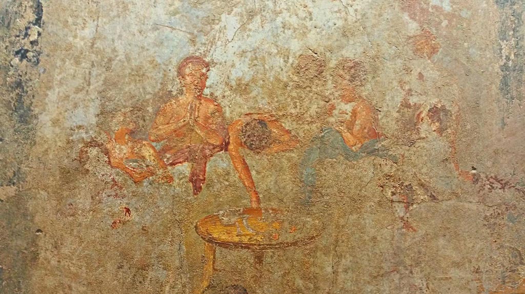 V.2.4 Pompeii. Room 15, detail from painting of banqueting scene from west wall of triclinium.
Now in Naples Archaeological Museum. Inventory number 120030. Photo courtesy of Giuseppe Ciaramella, June 2017.