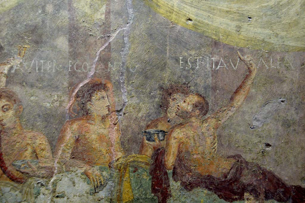 V.2.4 Pompeii. June 2017. 
Room 15, detail from east end of the painting of banqueting scene from north wall of triclinium. Photo courtesy of Johannes Eber.