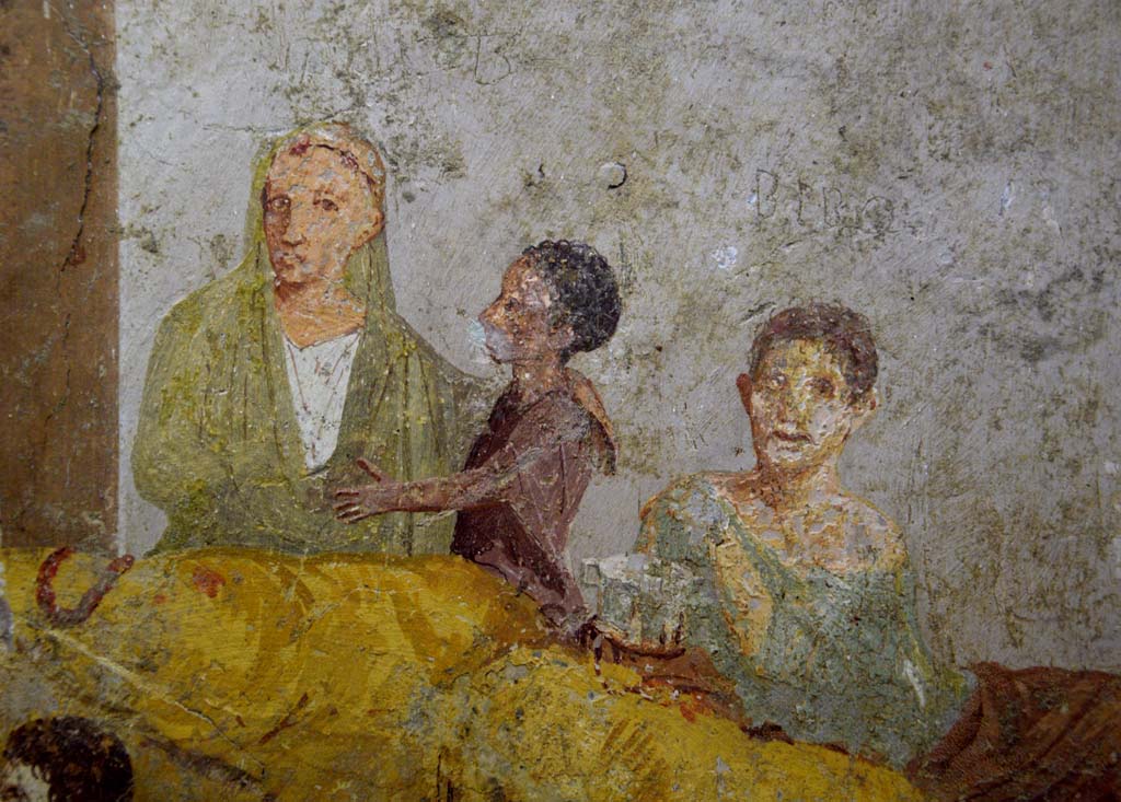 V.2.4 Pompeii. June 2017. 
Room 15, detail from painting of banqueting scene from east wall of triclinium. Photo courtesy of Johannes Eber.