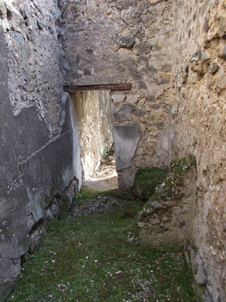 V.2.4 Pompeii. December 2007. Room 16. Corridor around the sides of room 17. Looking south towards latrine area.