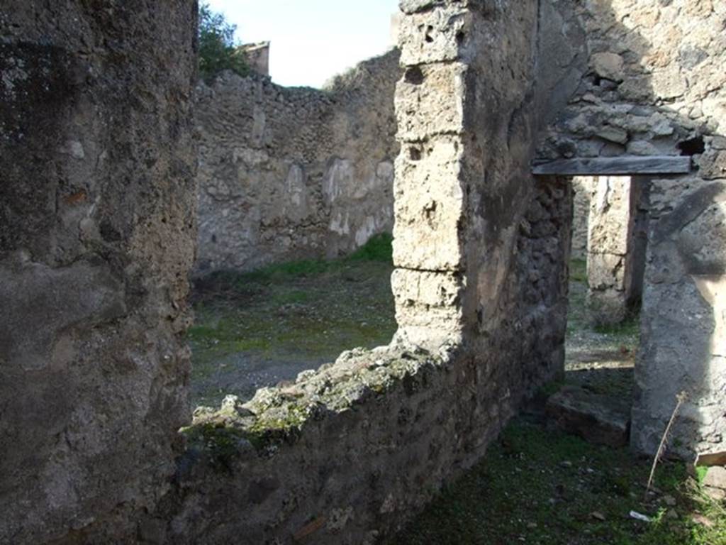 V.2.7 Pompeii. December 2007. Room 11, west wall with window onto garden area, and doorway into room 14.