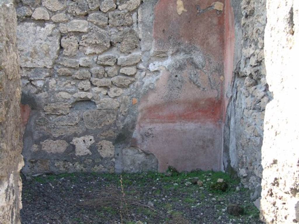 V.2.7 Pompeii. December 2007. Room 3, cubiculum, from doorway.
According to PPM, quoting Mau, this room would have been decorated in the III style.
The zoccolo/dado would have been painted black, the middle zone would have been divided into red panels.
The south wall, with black zoccolo, had a central white panel, with red side panels.