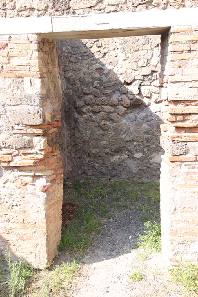 V.2.8 Pompeii. October 2023. 
Looking north through doorway into rear room. Photo courtesy of Klaus Heese.