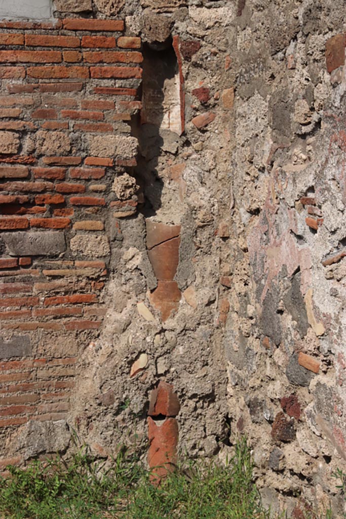 V.2.8 Pompeii. October 2023.
Terracotta downpipe in north-east corner of shop-room. Photo courtesy of Klaus Heese.