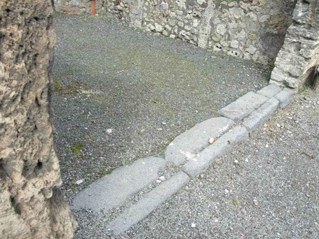 V.2.8 Pompeii. March 2009. Sill or threshold of entrance doorway into shop.