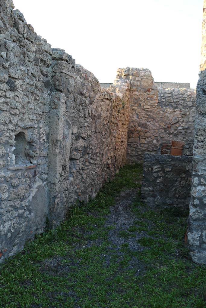 V.2.9, Pompeii. December 2018. 
West side of shop, looking north to rear room. Photo courtesy of Aude Durand.
