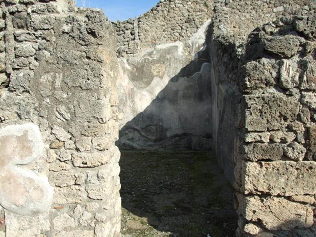 V.2.10 Pompeii. December 2007. Doorway to room 5.
According to NdS, this doorway led to a spacious room on a slightly higher level, and which could have been a triclinium.
It was decorated with two paintings, both relative to the myth of Daedalus and Pasiphae.
The one on the east wall, see below, was cut. 
Only a trace remained of the one on the west wall.
Straight ahead, Sogliano could see the figure of Pasiphae sitting on a throne and turning to the left.
She was wearing a purple robe fringed with blue.
To the left of her was the outline of a cow, near to which would have been the figure of Daedalus, who would have been almost in the middle.
See Notizie degli Scavi, 1891, p. 269.
See Notizie degli Scavi di Antichità, 1896, p. 437.
