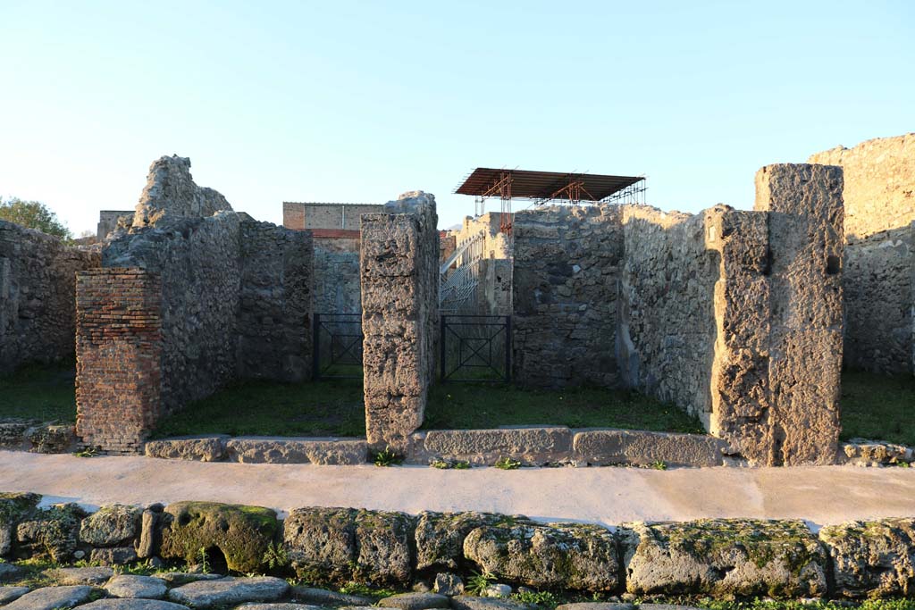 V.2.11, Pompeii, centre right, December 2018. 
Looking north to entrances, with V.2.10, centre left, and V.2.12, on right. Photo courtesy of Aude Durand.