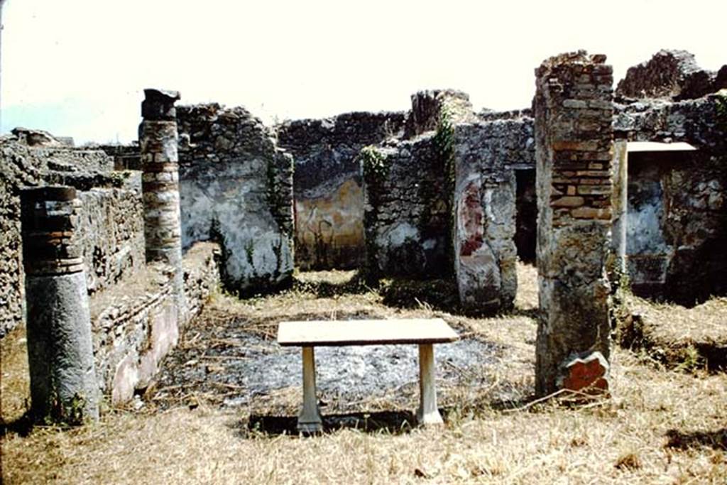 V.2.15 Pompeii. 1961. Looking south across peristyle to room 4 and room 5.  Photo by Stanley A. Jashemski.
Source: The Wilhelmina and Stanley A. Jashemski archive in the University of Maryland Library, Special Collections (See collection page) and made available under the Creative Commons Attribution-Non Commercial License v.4. See Licence and use details.
J61f0857