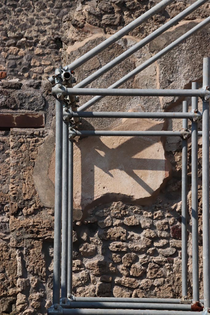 V.2.19 Pompeii. October 2022. 
North wall of rear room with detail of remaining plaster. Photo courtesy of Klaus Heese.