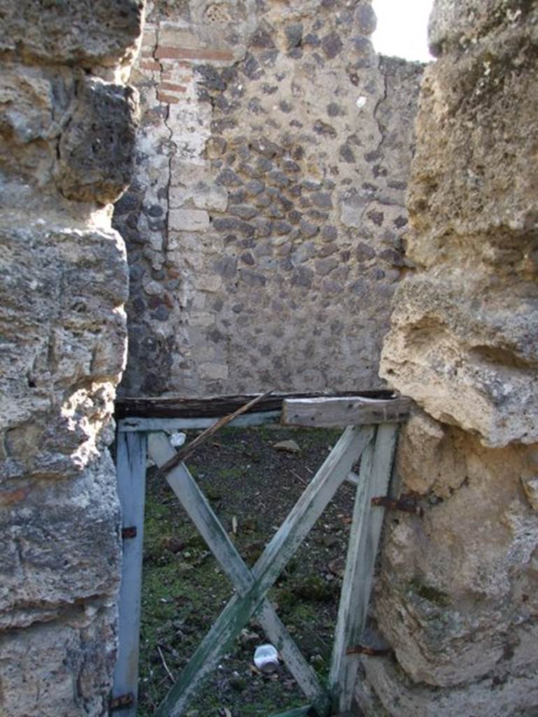 V.2.19 Pompeii. December 2007. 
Doorway in south wall of V.2.20 leading into small room at rear of V.2.17, with window overlooking V.2.19.