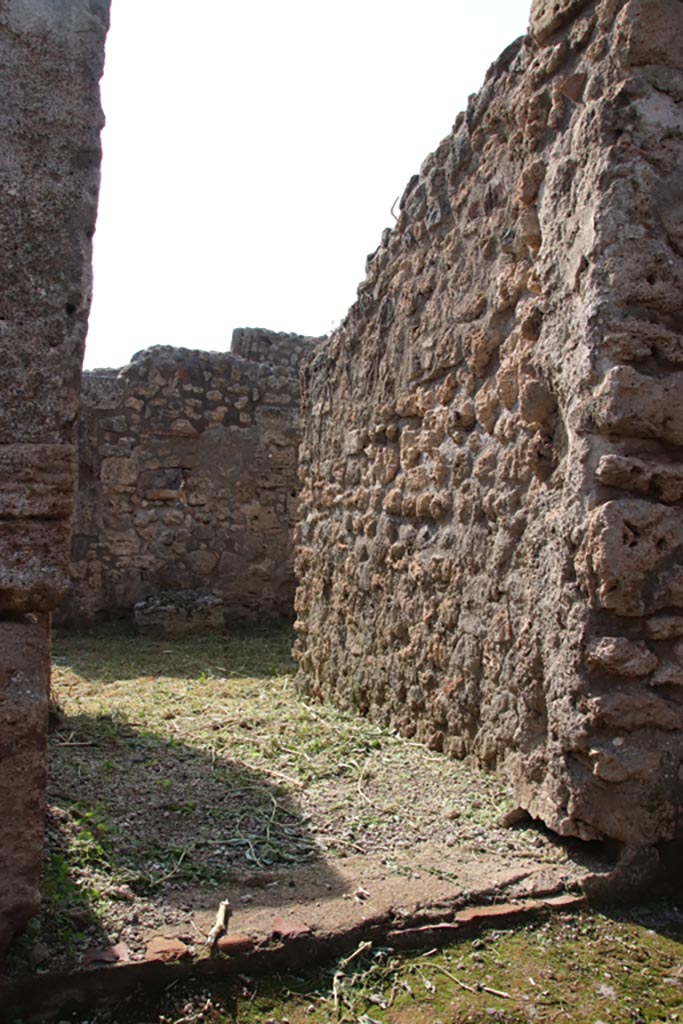 V.2.20 Pompeii. October 2022. 
Looking west towards entrance doorway on Vicolo dei Balconi. Photo courtesy of Klaus Heese.