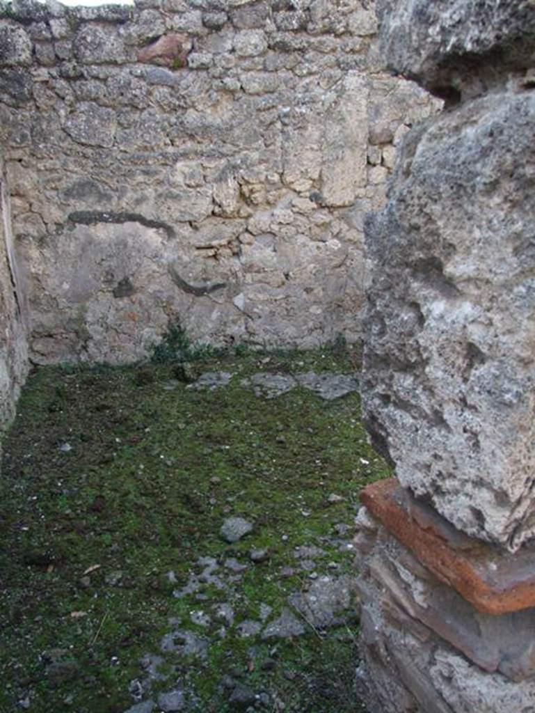 V.2.20 Pompeii. December 2007. Looking west through doorway of small room on west side of light-yard.