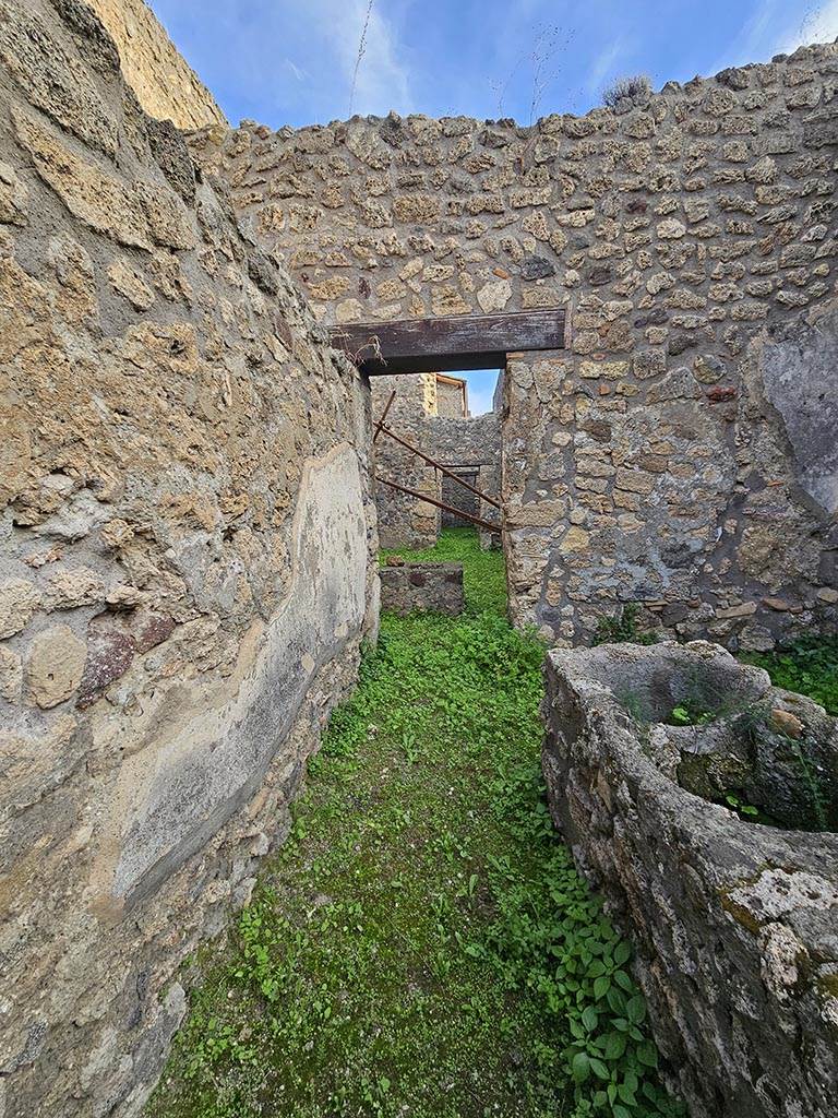 V.2.b Pompeii. November 2024. 
Looking east across bar-room towards rear rooms, part of V.2.c.  Photo courtesy of Annette Haug.