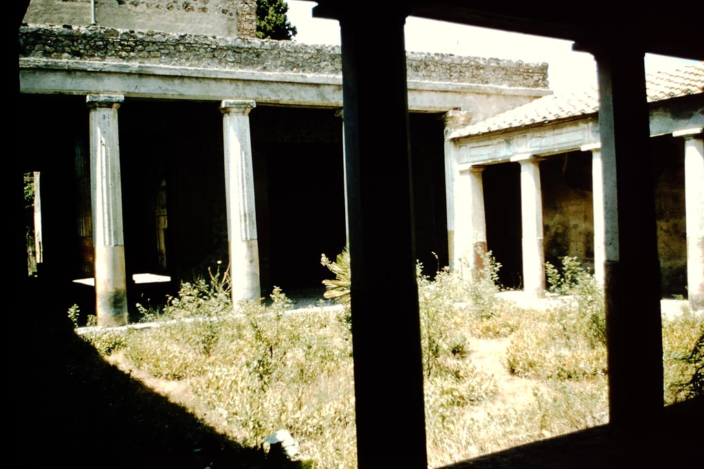 V.2.i Pompeii. 1957. Looking north-east across peristyle area, from south portico. Photo by Stanley A. Jashemski.
Source: The Wilhelmina and Stanley A. Jashemski archive in the University of Maryland Library, Special Collections (See collection page) and made available under the Creative Commons Attribution-Non Commercial License v.4. See Licence and use details.
J57f0145
