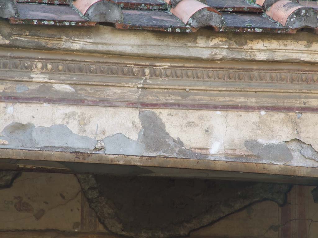 V.2.i Pompeii. December 2007. Room 23, details of painted lintels and plaster stucco in Rhodian peristyle.
