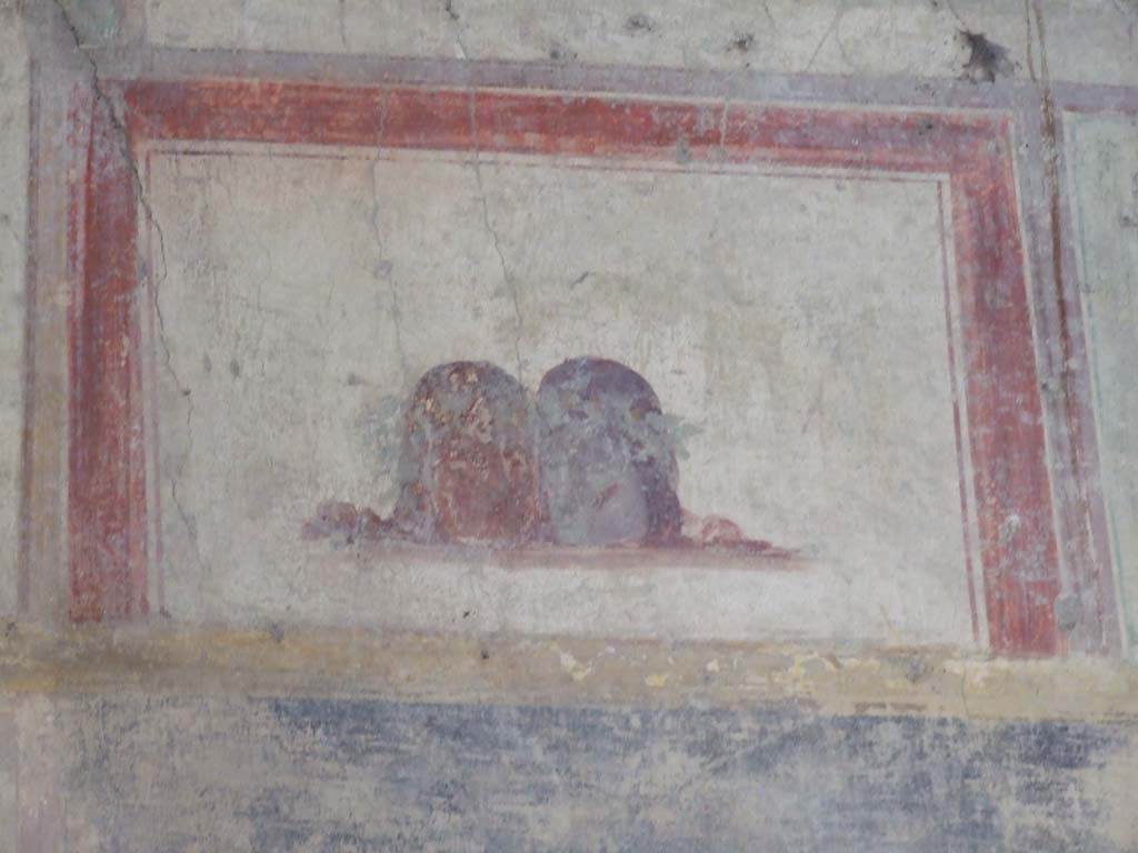 V.2.i Pompeii. December 2007. Room 23, painted masks on south side of Rhodian peristyle.