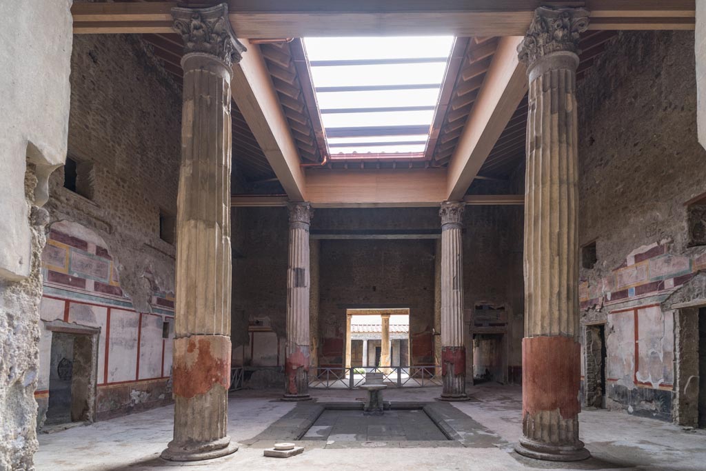 V.2.i Pompeii. March 2023. 
Room 1, atrium and impluvium looking south towards tablinum and peristyle, with restored compluvium above. Photo courtesy of Johannes Eber.