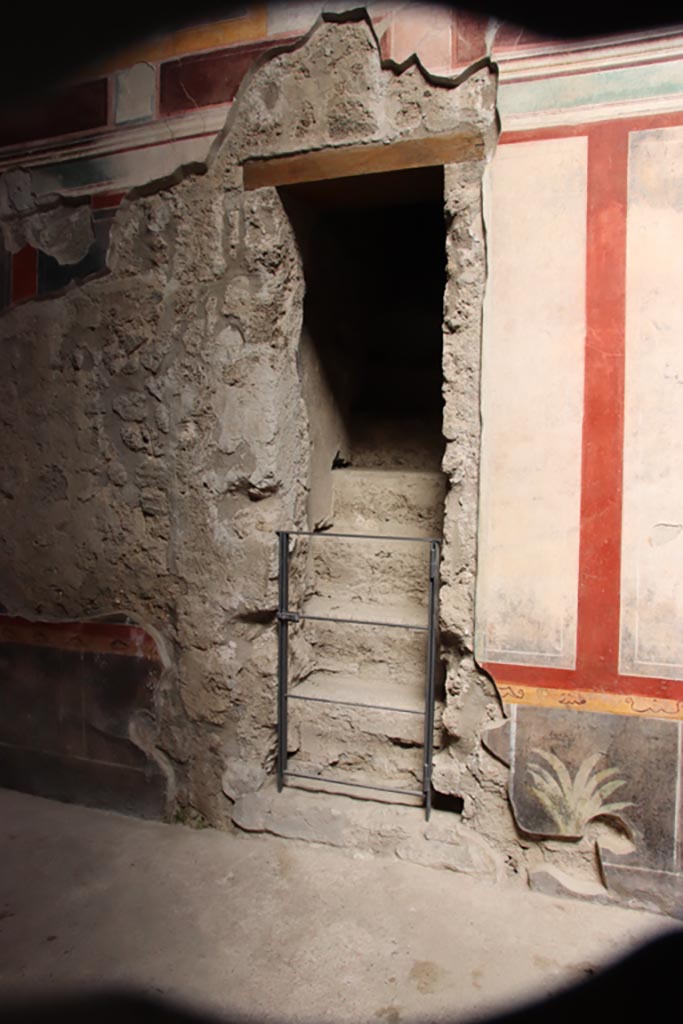 V.2.i Pompeii.  October 2023. 
Room 1, east side of atrium, stone staircase between room 3 and room 4.
Photo courtesy of Klaus Heese.
