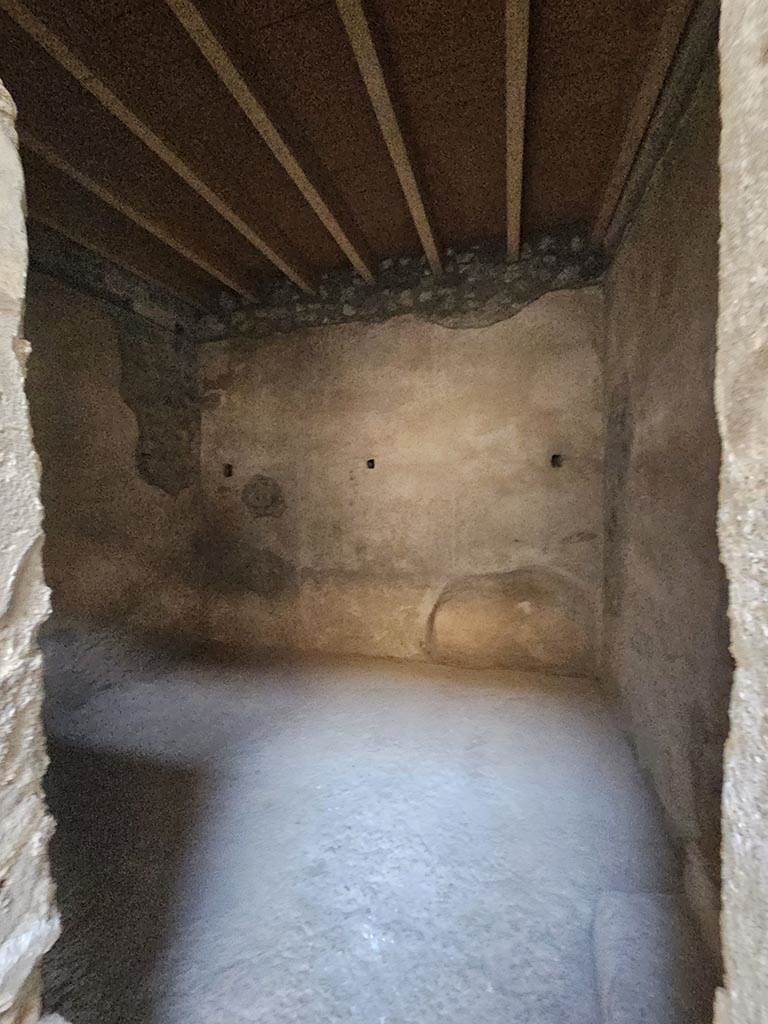 V.2.i Pompeii. November 2024. 
Room 2c, looking west through doorway and across flooring. Photo courtesy of Annette Haug.