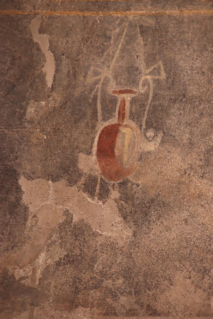V.2.i Pompeii.  October 2023. 
Tablinum 7, detail from zoccolo with black panel on lower south end of west wall. 
Photo courtesy of Klaus Heese.
