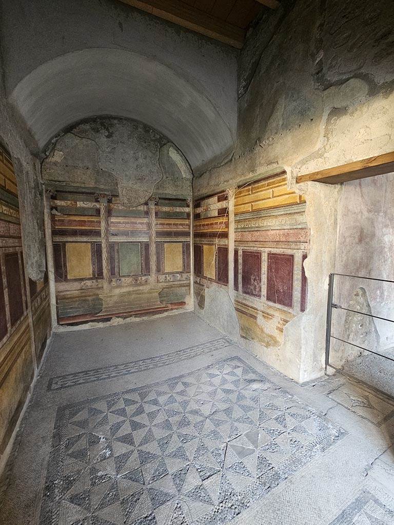V.2.i Pompeii. November 2024. 
Room 18, looking towards south wall, south-west corner and west wall. Photo courtesy of Annette Haug.