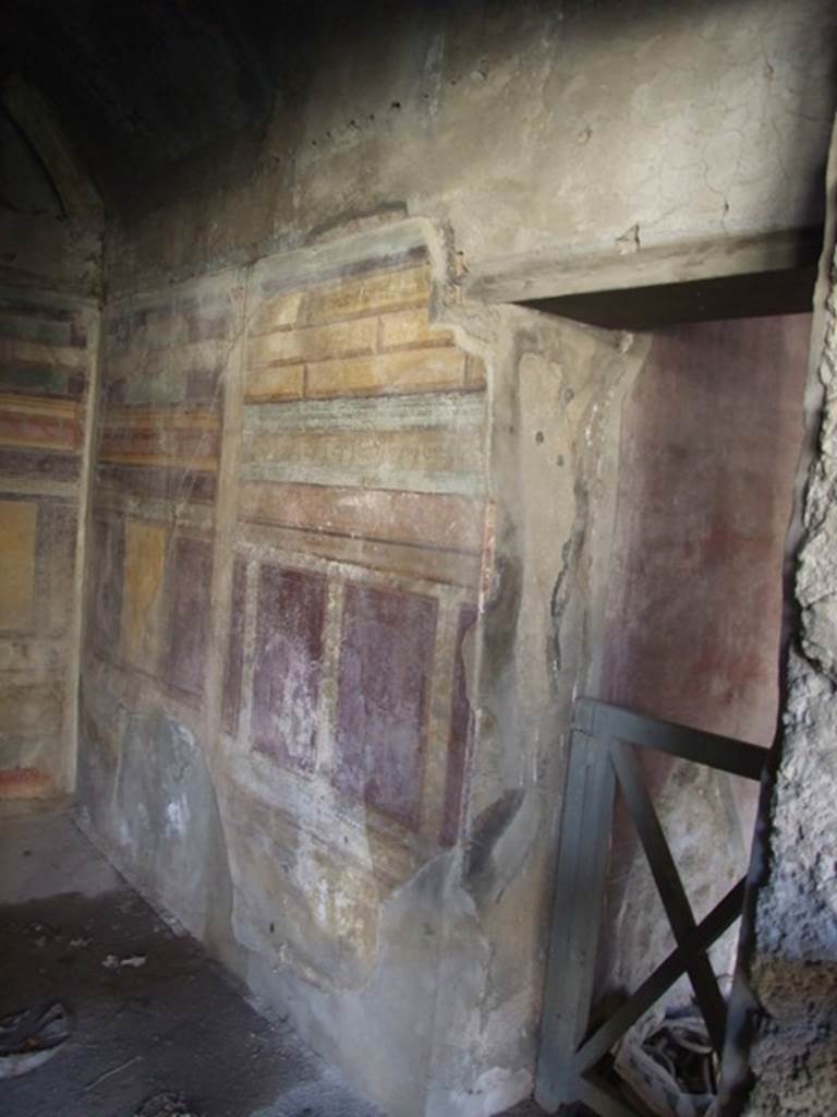 V.2.i Pompeii. December 2007.  Room 18, west wall with entrance from small passage to room 17 on right hand side.