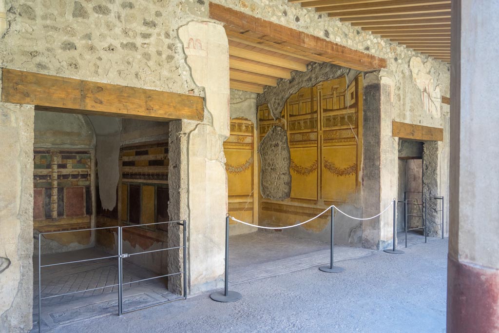 V.2.i Pompeii. August 2023. South portico of peristyle, with doorway to room 20, on left. Photo courtesy of Johannes Eber.
