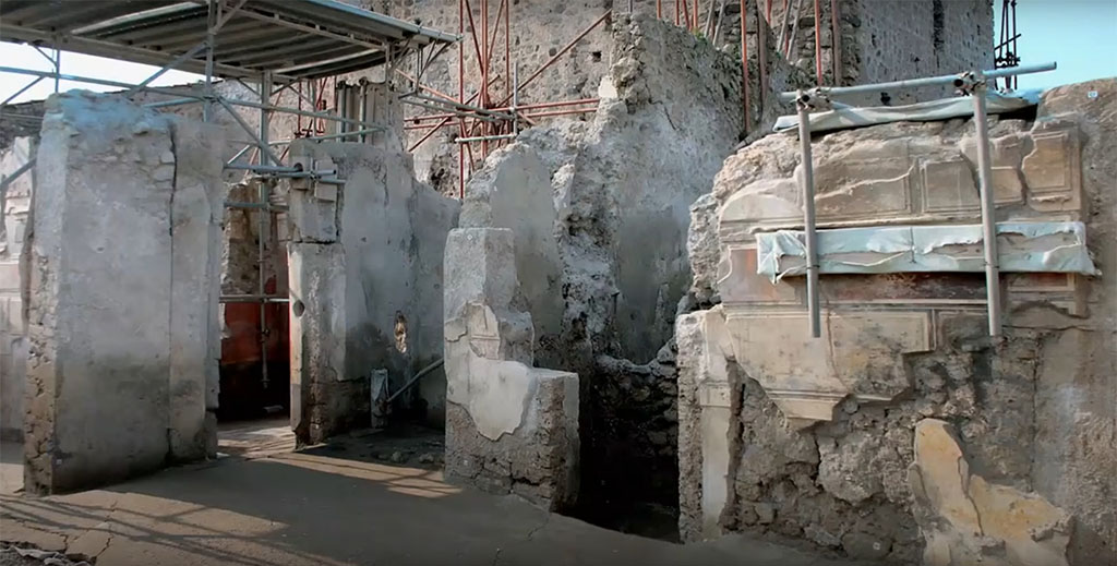 V.2.Pompeii. Casa di Orione. March 2020. Doorway to room A6 a room with red painted plaster is left. 
To its right is small room A18 and further right is one of the entrances to room A15.
Photograph © Parco Archeologico di Pompei.