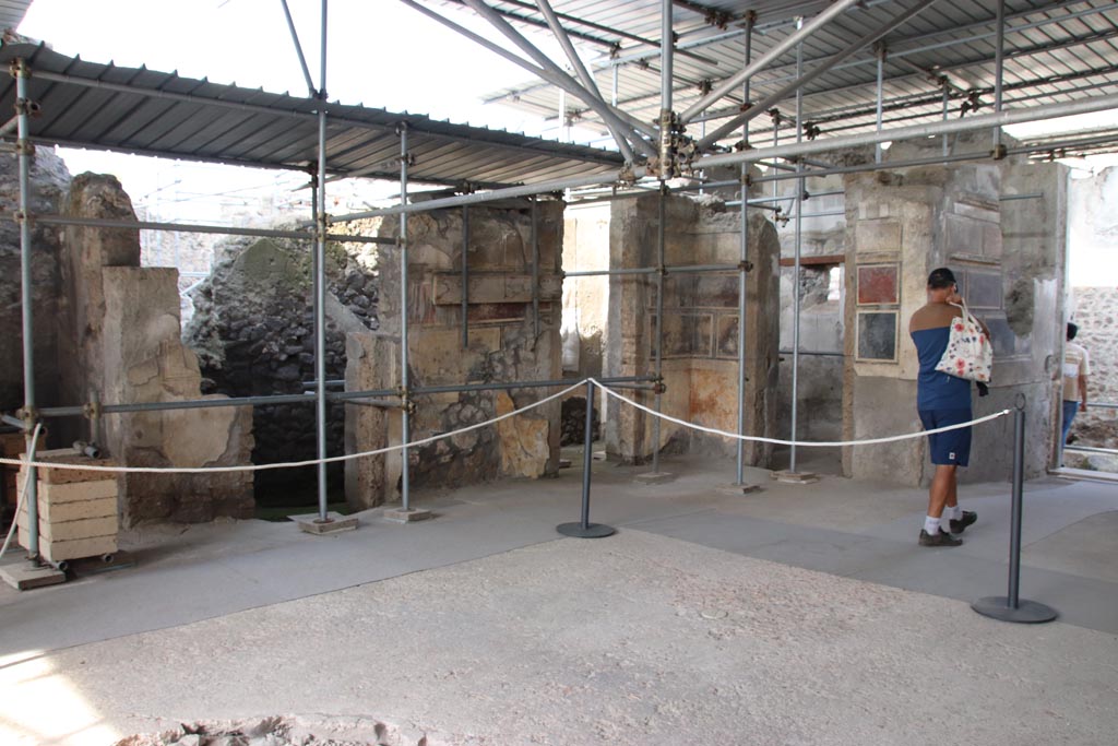 V.2 Pompeii. Casa di Orione. October 2022. 
Atrium A12, looking north-east with doorways to rooms A15 (two doorways), A5 and entrance corridor A4, on right. Photo courtesy of Klaus Heese.