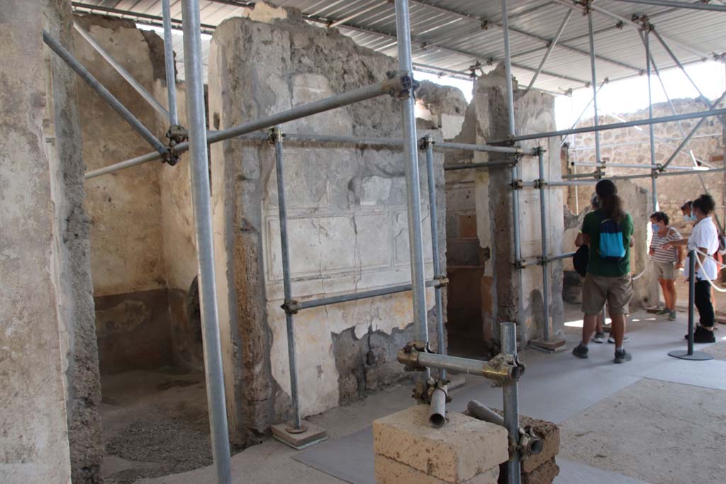 V.2.Pompeii. Casa di Orione. September 2021. 
Looking towards doorways to rooms A17, A11, and A13 on south side of atrium A12. Photo courtesy of Klaus Heese.