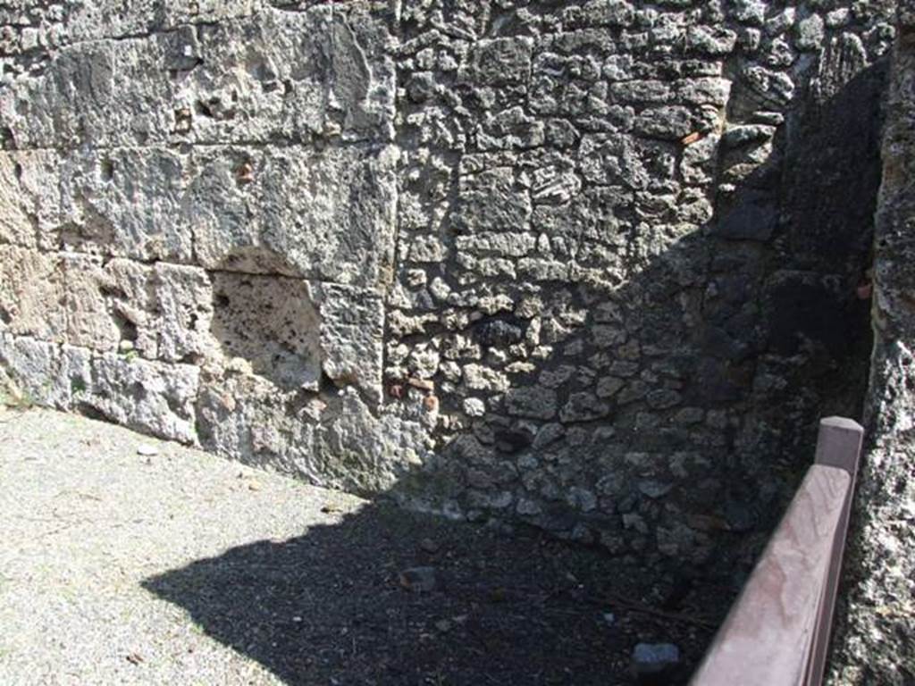 V.3.2 Pompeii.  March 2009. East wall. According to Liselotte Eschebach, on the right side (east) were the stairs to the upper floor and a lararium.
See Eschebach, L., 1993. Gebäudeverzeichnis und Stadtplan der antiken Stadt Pompeji. Köln: Böhlau. (p. 137)