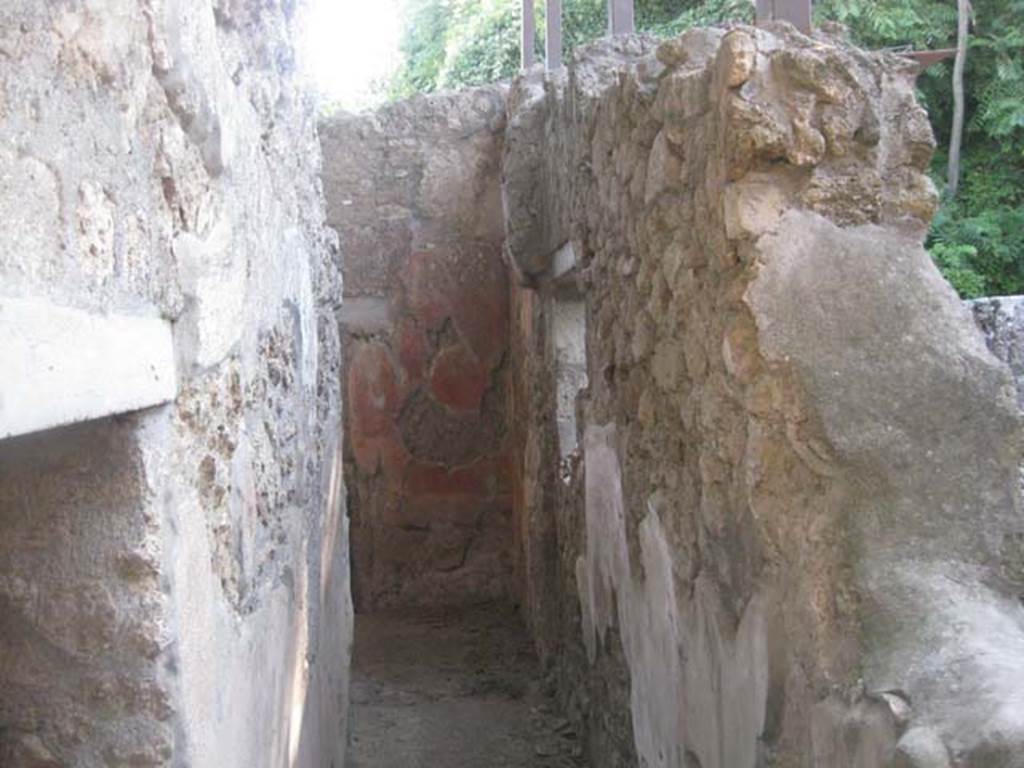V.3.4 Pompeii. July 2012. Corridor looking west to north-west corner of front room.
Photo courtesy of Sharon M. Wolf.