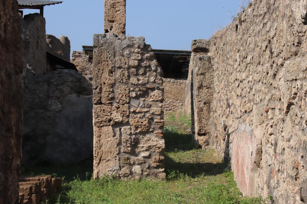 V.3.7 Pompeii. October 2023. 
Looking north along east wall of atrium, on right, with corridor to garden area. Photo courtesy of Klaus Heese.