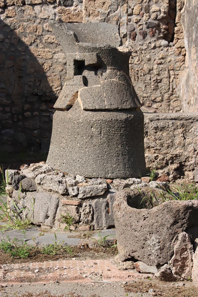 V.3.8 Pompeii. October 2023. 
North side of impluvium, remains of mill, and catillus and meta. Photo courtesy of Klaus Heese.