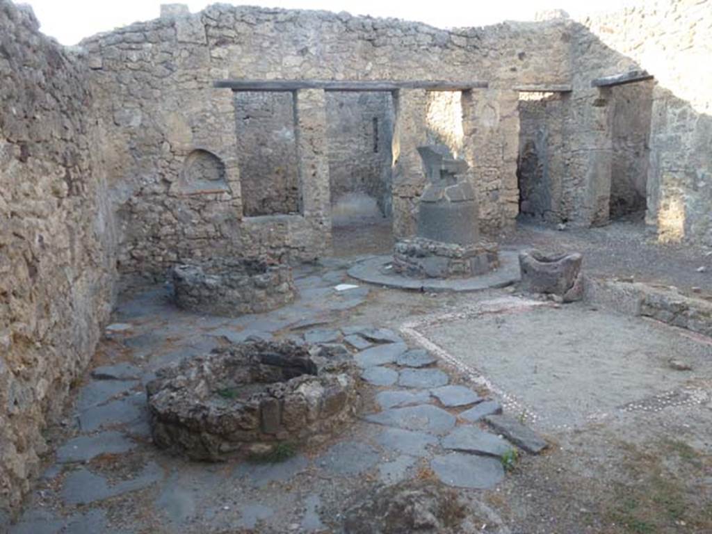 V.3.8 Pompeii. June 2012.  Looking north across west side of bakery atrium.  Photo courtesy of Michael Binns.
