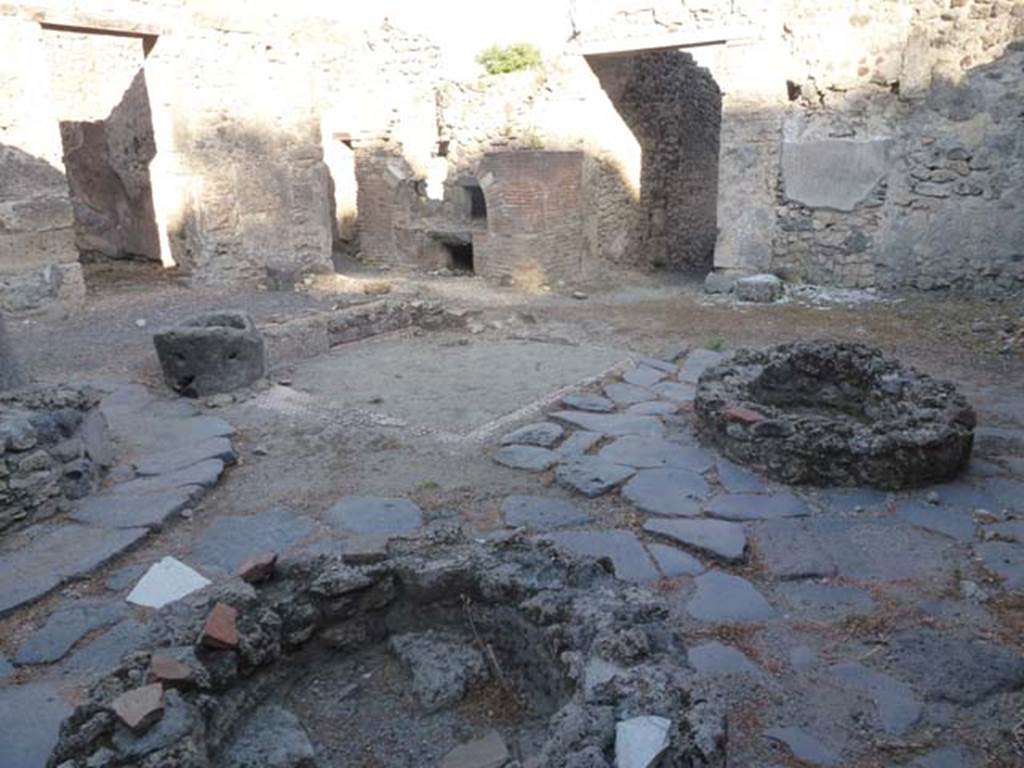V.3.8 Pompeii. June 2012. Looking south-east across bakery in atrium towards the oven. 
Photo courtesy of Michael Binns.