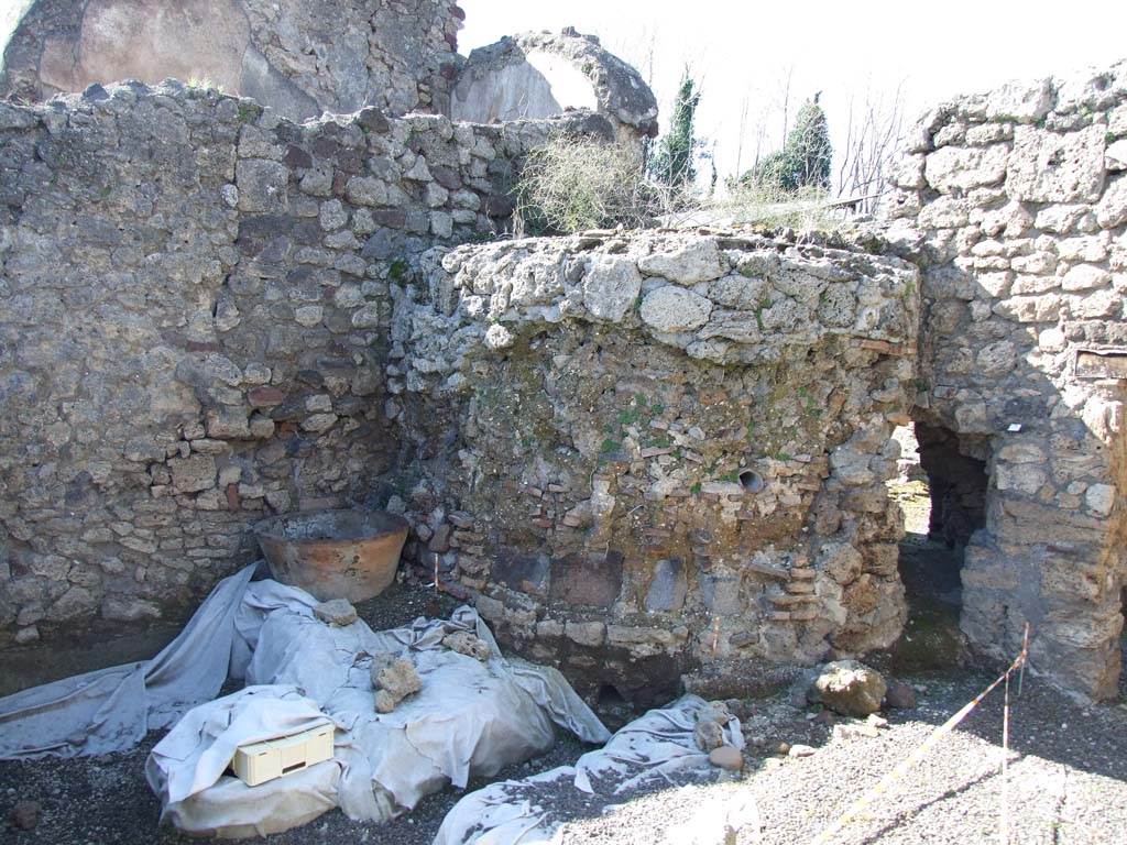 V.3.8 Pompeii. March 2009. North-west corner of large room behind oven.