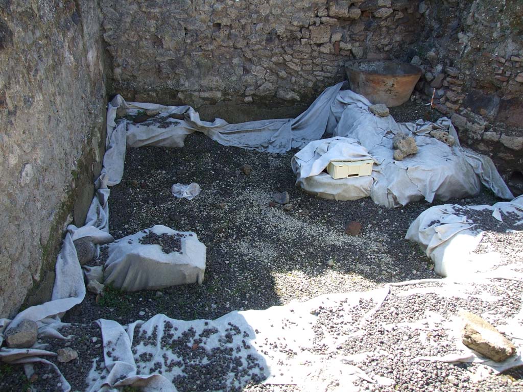 V.3.8 Pompeii. March 2009. North-west corner of large room behind oven.