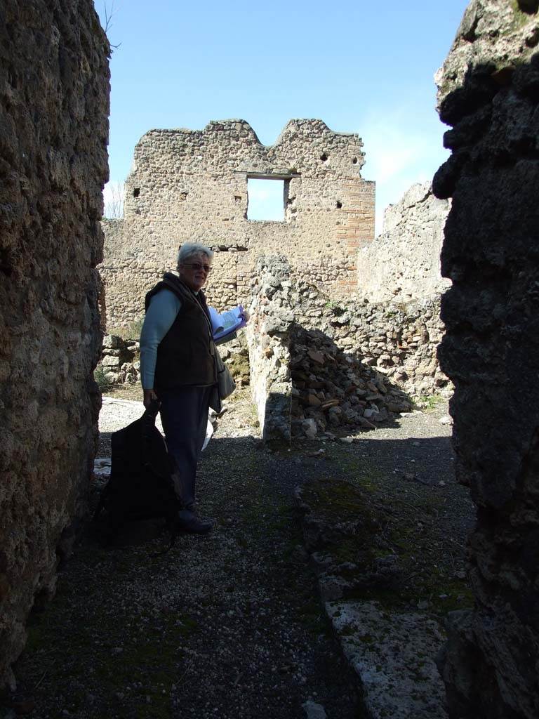 V.3.8 Pompeii. March 2009. Looking north along corridor with narrow room on the east side.