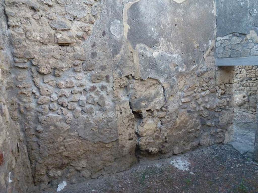 V.3.8 Pompeii. June 2012. North wall of front room on west side of entrance corridor.
Photo courtesy of Michael Binns.