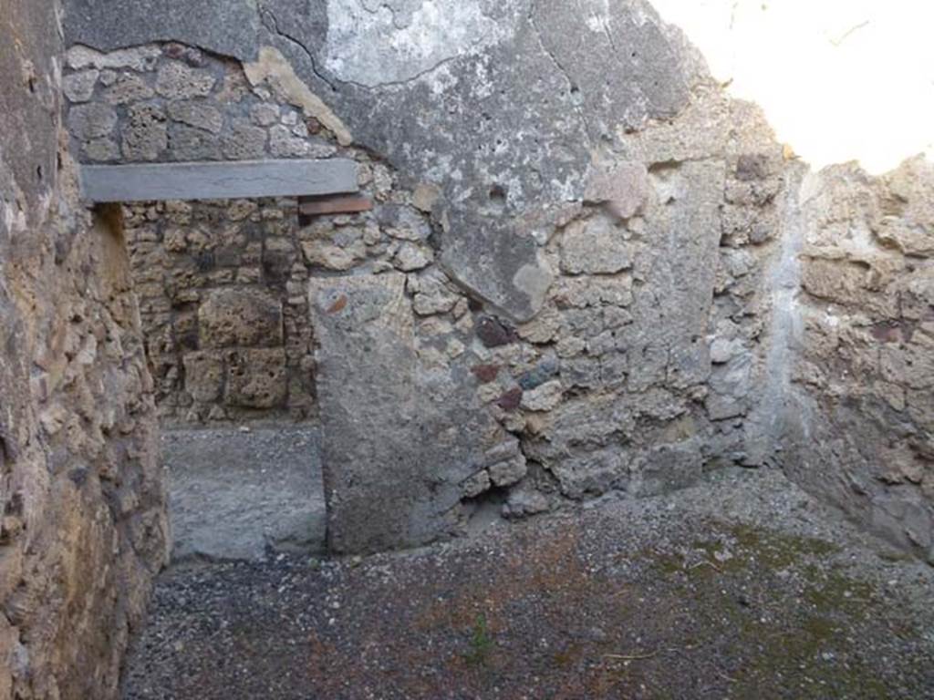 V.3.8 Pompeii. June 2012. East wall of front room on west side of entrance corridor. 
Photo courtesy of Michael Binns.