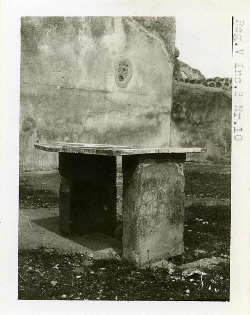 V.3.10 Pompeii, but shown as V.2.10 on photo. Pre-1937-39. Looking across table on west side of impluvium, towards north-east corner of atrium.
Photo courtesy of American Academy in Rome, Photographic Archive. Warsher collection no. 879
According to PPM, 
The atrium flooring was decorated with white tesserae, of which traces were visible on the base of the impluvium, covered with cocciopesto. 
The supports of the masonry table were painted in fake marble, the table was situated on the west side of the impluvium.
See Carratelli, G. P., 1990-2003. Pompei: Pitture e Mosaici: Vol. III. Roma: Istituto della enciclopedia italiana, (p. 931 pl.2.)