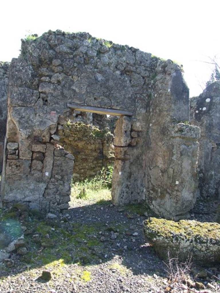 V.3.11 Pompeii. March 2009. Doorway to kitchen, storeroom and latrine. In 1902, the kitchen and latrine were not yet fully excavated.