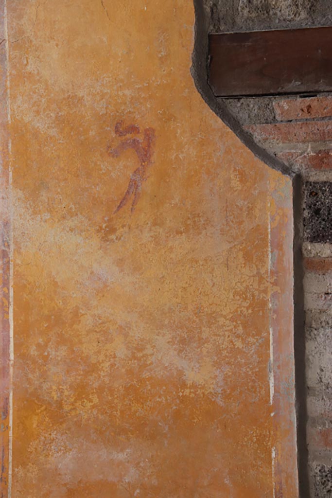 V.3 Pompeii. Casa del Giardino. October 2022. 
Portico 10, looking towards west wall at south end of doorway to room 7, painted decoration.
Photo courtesy of Klaus Heese.