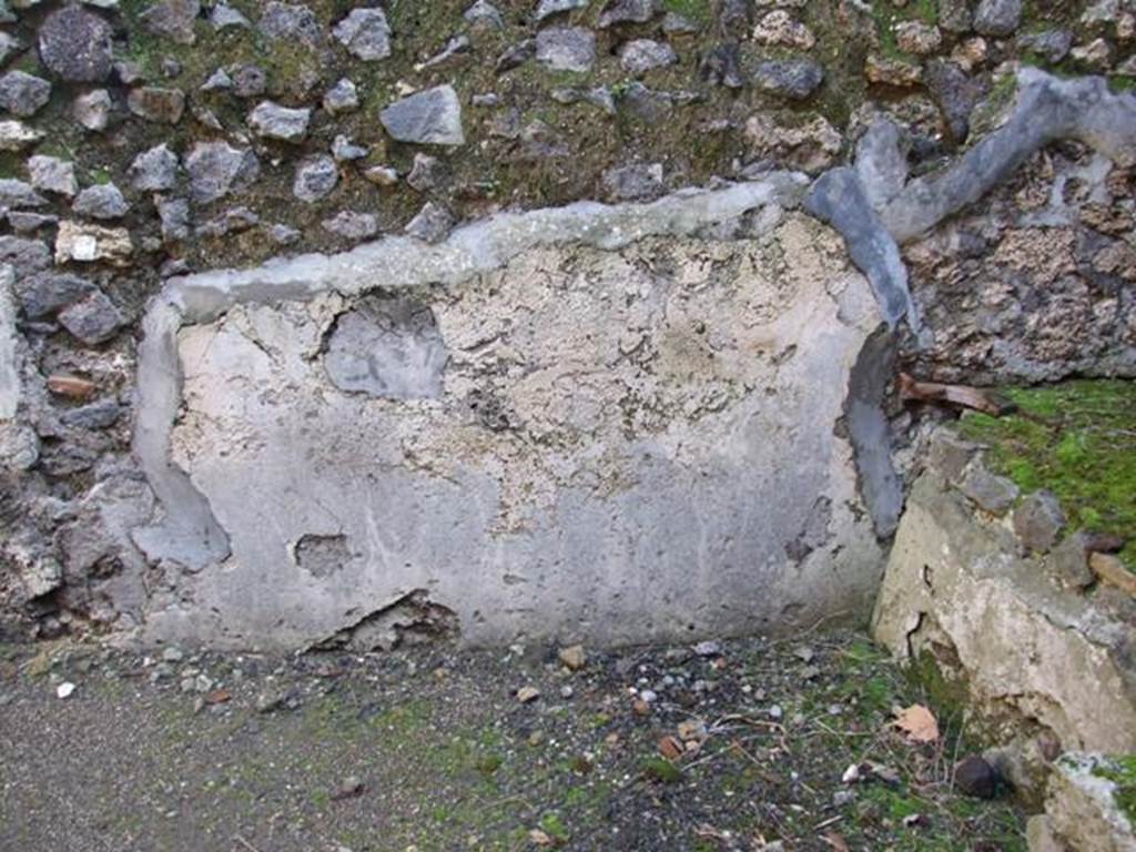 V.4.3 Pompeii.  March 2009. East wall of Kitchen.  Site of Lararium painting, which had three zones, now faded and destroyed. See Fröhlich, T., 1991. Lararien und Fassadenbilder in den Vesuvstädten. Mainz: von Zabern. L53 on p.272. See Giacobello, F., 2008. Larari Pompeiani: Iconografia e culto dei Lari in ambito domestico.  Milano: LED Edizioni, p.169.  See Boyce G. K., 1937. Corpus of the Lararia of Pompeii. Rome: MAAR 14.  (119b).