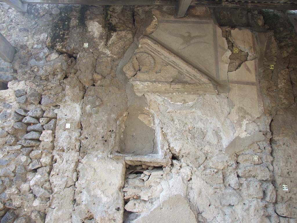 V.4.3 Pompeii. March 2009. West wall of atrium.
Remains of aedicula lararium, mostly destroyed by the 16th of September 1943 bombing and not recoverable.