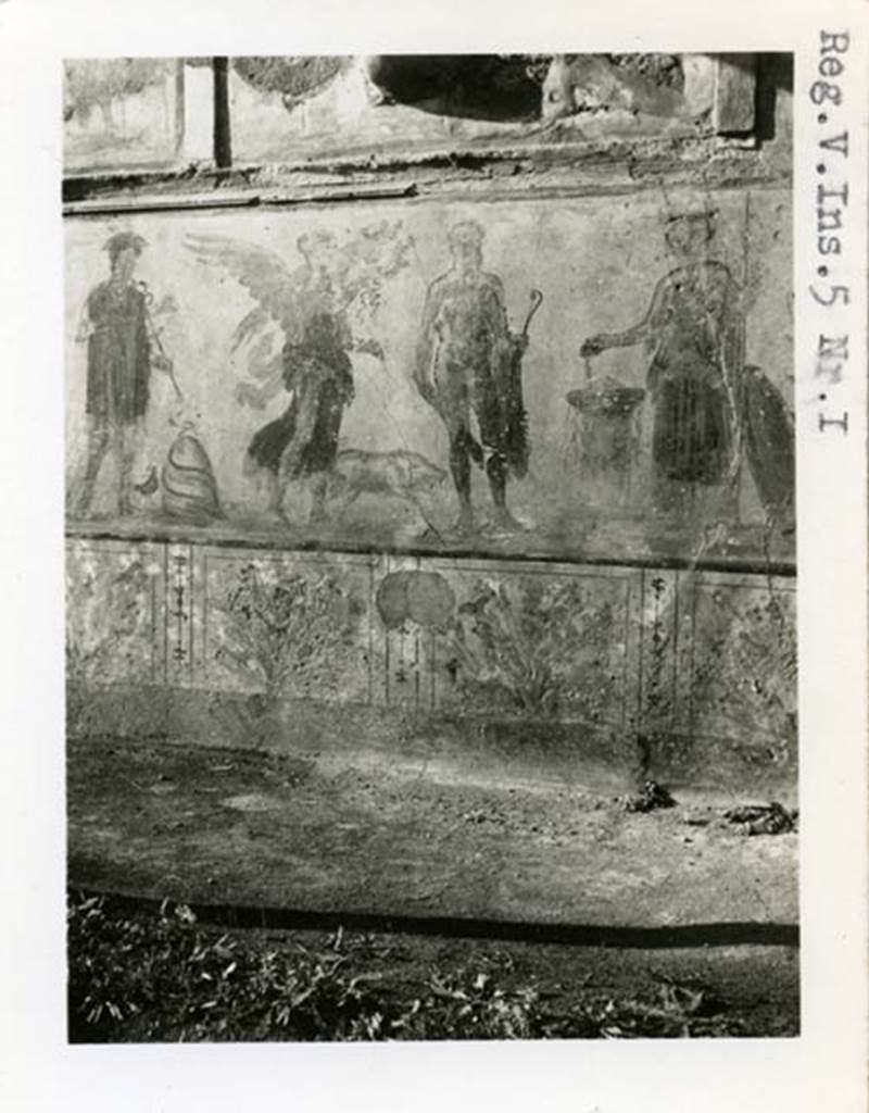 V.4.3 Pompeii, but shown as V.5.1 on photo. 1937-39. Lower part of lararium painting from west wall of atrium. Mercury, Victoria, Hercules and Minerva. Photo courtesy of American Academy in Rome, Photographic Archive. Warsher collection no. 1568a.